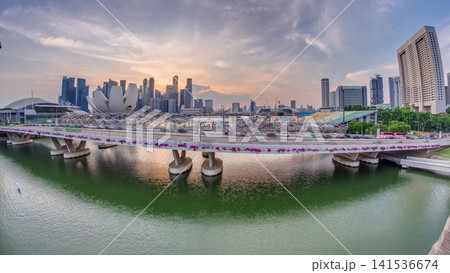 Aerial view of sunset over Helix Bridge and Bayfront Avenue with traffic timelapse at Marina Bay, Singapore Aerial view of sunset over Helix Bridge and Bayfront Avenue with traffic timelapse at Marina Bay, Singapore 141536674