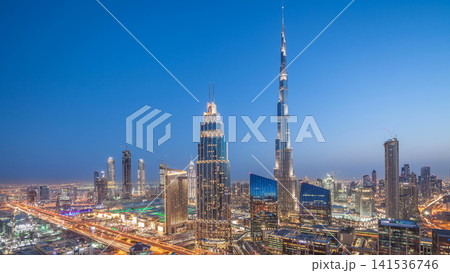 Dubai downtown skyline day to night timelapse with tallest building and Sheikh Zayed road traffic, UAE 141536746
