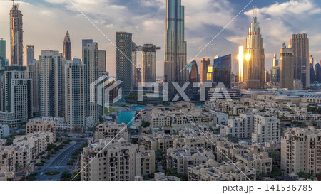 Dubai Downtown skyline during sunset timelapse with Burj Khalifa and other towers panoramic view from the top in Dubai Dubai Downtown skyline during sunset timelapse with Burj Khalifa and other towers panoramic view from the top in Dubai 141536785