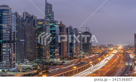 Aerial top view to Sheikh Zayed road near Dubai Marina and JLT day to night timelapse, Dubai. 141536807