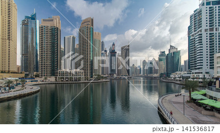 Dubai Marina towers and canal in Dubai night to day timelapse 141536817