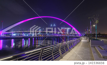Pedestrian Bridge over the Dubai Water Canal night timelapse hyperlapse, United Arab Emirates Pedestrian Bridge over the Dubai Water Canal night timelapse hyperlapse, United Arab Emirates 141536838