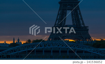 Eiffel Tower sunrise timelapse with boats on Seine river and in Paris, France. 141536852