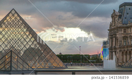 The Louvre museum pyramid at sunset timelapse in Paris, France The Louvre museum pyramid at sunset timelapse in Paris, France 141536859