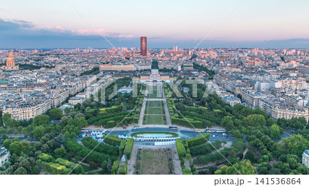 Aerial view of a large city skyline at sunset timelapse. Top view from the Eiffel tower. Paris, France. Aerial view of a large city skyline at sunset timelapse. Top view from the Eiffel tower. Paris, France. 141536864