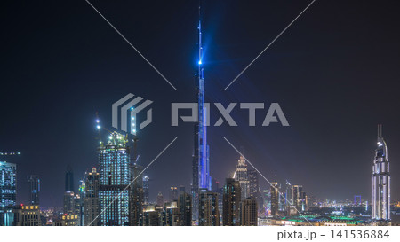 Dubai downtown cityscape with Burj Khalifa, LightUp light show aerial timelapse Dubai downtown cityscape with Burj Khalifa, LightUp light show aerial timelapse 141536884