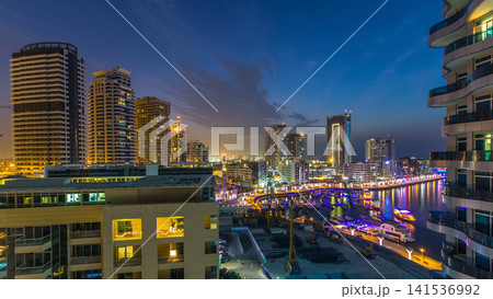 An Aerial view of Dubai Marina towers in Dubai day to night timelapse An Aerial view of Dubai Marina towers in Dubai day to night timelapse 141536992