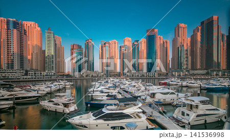Dubai Marina at early morning hour timelapse with yachts Dubai Marina at early morning hour timelapse with yachts 141536998