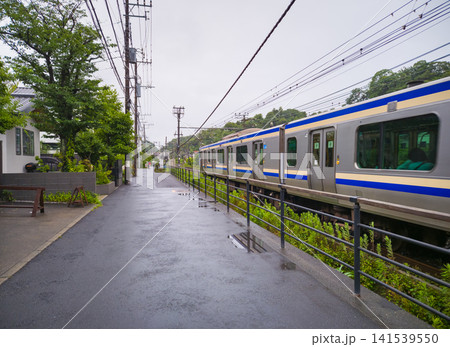 Train passing by a station near Meigetsu-in in Kamakura, Japan Train passing by a station near Meigetsu-in in Kamakura, Japan 141539550