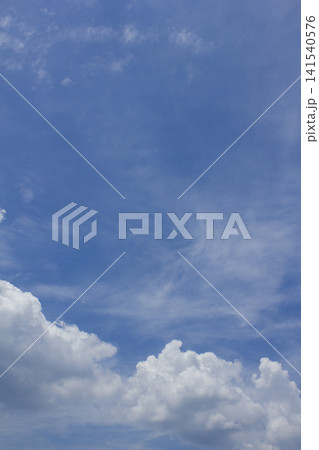 It is a blue sky with fluffy clouds. It is a blue sky with fluffy clouds. 141540576