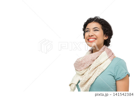 Woman in teal top scarf posing right looking up smiling against seamless white backdrop, copy space Woman in teal top scarf posing right looking up smiling against seamless white backdrop, copy space 141542384