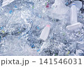 Close-up of trash and plastic debris on sandy beach 141546031