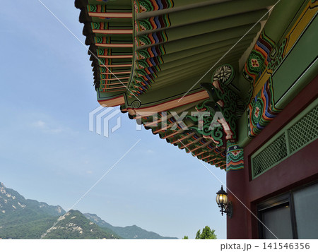 It is a landscape featuring a roof with *dancheong* (traditional decorative coloring). It is a landscape featuring a roof with *dancheong* (traditional decorative coloring). 141546356