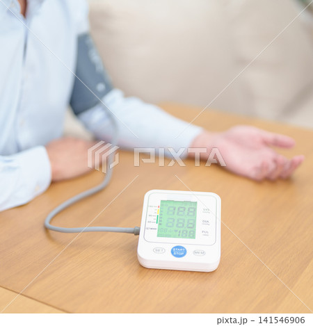 Man checking Blood pressure by Blood pressure monitor with Cuff. Systolic, SYS, Diastolic, DIA, Pulse, Hypertension, Hypotension, Heart rate, Cardiovascular Disease and May World hypertension day Man checking Blood pressure by Blood pressure monitor with Cuff. Systolic, SYS, Diastolic, DIA, Pulse, Hypertension, Hypotension, Heart rate, Cardiovascular Disease and May World hypertension day 141546906