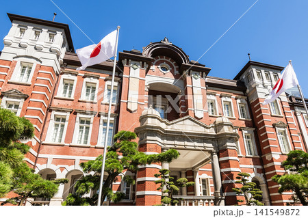 Building view of the Tokyo Station. It's a major inter-city rail terminal in Chiyoda, Tokyo, Japan. Located in the Marunouchi business district.  141549872