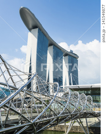 Building view of The Helix Bridge and the Marina Bay Sands Resort, Singapore, it's a pedestrian bridge linking the Marina Centre with Marina South. Building view of The Helix Bridge and the Marina Bay Sands Resort, Singapore, it's a pedestrian bridge linking the Marina Centre with Marina South. 141549877