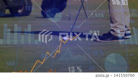 Aligning golfer's legs and putter on green, with golf ball, beige trousers, dark shoes, data graphs Aligning golfer's legs and putter on green, with golf ball, beige trousers, dark shoes, data graphs 141550700