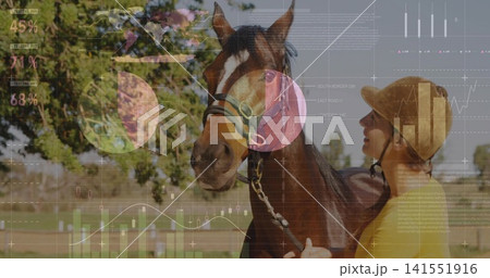Standing bay horse, handler wearing helmet, yellow top holding lead in paddock, overlaid charts 141551916
