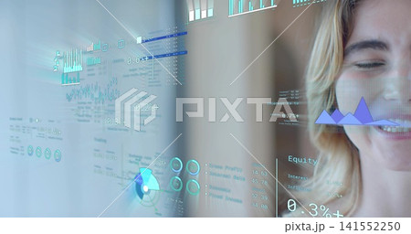 Smiling woman wearing light top near glass panel in modern office, showing AR charts, copy space 141552250