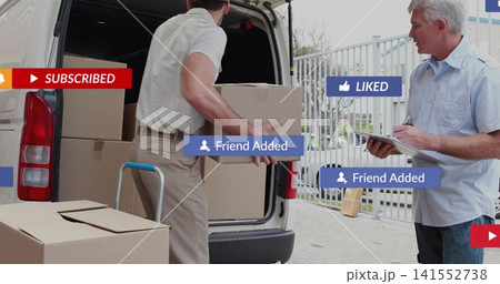 Lifting mover in short-sleeve shirt, khakis loading boxes at driveway, dolly, clipboard, overlays Lifting mover in short-sleeve shirt, khakis loading boxes at driveway, dolly, clipboard, overlays 141552738