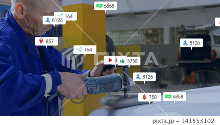 Buffing mechanic in blue coveralls using polisher on white hood in garage, with bubbles, copy space Buffing mechanic in blue coveralls using polisher on white hood in garage, with bubbles, copy space 141553102