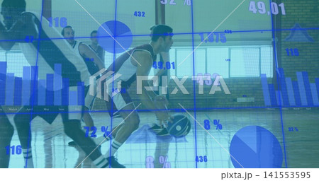 Dribbling male basketball player in jersey crouching on gym court holding ball and data overlay Dribbling male basketball player in jersey crouching on gym court holding ball and data overlay 141553595
