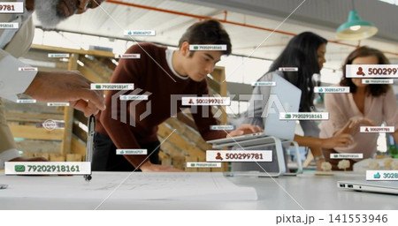 Leaning adult male in burgundy sweater studying blueprint at studio, with laptop compass overlays Leaning adult male in burgundy sweater studying blueprint at studio, with laptop compass overlays 141553946