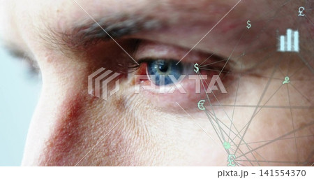 Focusing adult male face showing blue eye skin pores in studio closeup with financial overlay Focusing adult male face showing blue eye skin pores in studio closeup with financial overlay 141554370