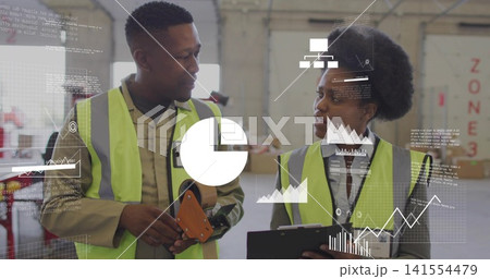 Checking two staff in safety vests comparing inventory data in packing bay with tape, clipboard Checking two staff in safety vests comparing inventory data in packing bay with tape, clipboard 141554479