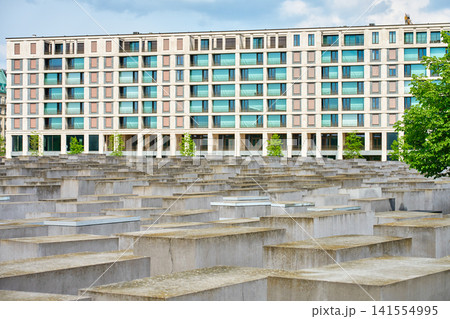 Berlin Holocaust Memorial with Modern Apartment Building in Background Berlin Holocaust Memorial with Modern Apartment Building in Background 141554995