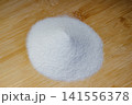 Aluminum oxide or electrocorundum - a pile of white abrasive powder with a grain size of 250 micrometers, formula Al2O3 141556378
