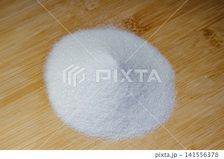 Aluminum oxide or electrocorundum - a pile of white abrasive powder with a grain size of 250 micrometers, formula Al2O3 Aluminum oxide or electrocorundum - a pile of white abrasive powder with a grain size of 250 micrometers, formula Al2O3 141556378