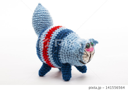 A crocheted cat toy on a white background A crocheted cat toy on a white background 141556564