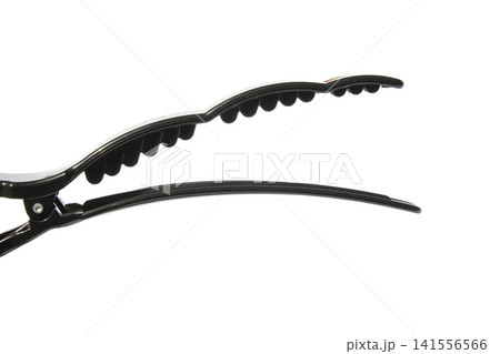 It is a hair clip from a hair salon placed on a white background. It is a hair clip from a hair salon placed on a white background. 141556566