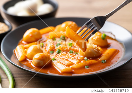 Tteokbokki with quail eggs ready to eat, Korean spicy rice cake traditional food Tteokbokki with quail eggs ready to eat, Korean spicy rice cake traditional food 141556719