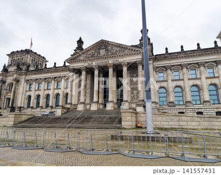 German Reichstag Building in Berlin with Waving National Flag German Reichstag Building in Berlin with Waving National Flag 141557431