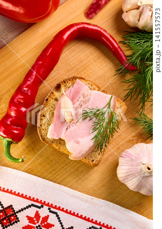 Traditional Ukrainian Feast Composition with Salo and Vegetables Traditional Ukrainian Feast Composition with Salo and Vegetables 141557573