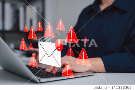 Email security threat and spam warning concept. Person using laptop with red warning icons and envelope representing email threats, phishing, spam alerts, cybersecurity risk in digital communication. Email security threat and spam warning concept. Person using laptop with red warning icons and envelope representing email threats, phishing, spam alerts, cybersecurity risk in digital communication. 141558365
