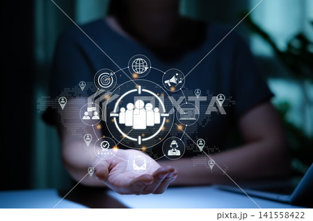 Digital Marketing and Target Audience Concept. Person holding marketing icon represent targeting, customer engagement. global reach, sale growth, customer acquisition, modern strategy in online market Digital Marketing and Target Audience Concept. Person holding marketing icon represent targeting, customer engagement. global reach, sale growth, customer acquisition, modern strategy in online market 141558422