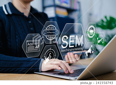 SEM, Search Engine Marketing Concept. Businessperson working on laptop with SEM icons, featuring ads, analytics, keywords, reach, pay per click, online marketing tools, digital advertising strategy, SEM, Search Engine Marketing Concept. Businessperson working on laptop with SEM icons, featuring ads, analytics, keywords, reach, pay per click, online marketing tools, digital advertising strategy, 141558743