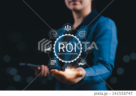 Analyzing ROI and Business Strategy Concepts. Businessperson holding digital icon representing ROI, financial strategies, return on investment, and efficiency. calculate profit, marketing plan, profit 141558747