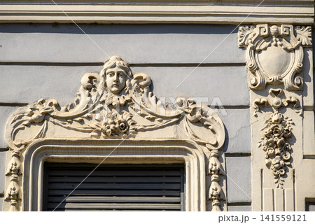 Ornate historic window detail on classic building facade Ornate historic window detail on classic building facade 141559121