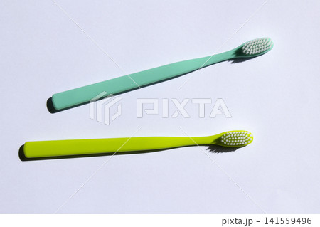 This is a collection of colorful toothbrushes. This is a collection of colorful toothbrushes. 141559496