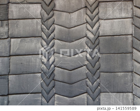 Decorative slate roof with braided ridge tiles Decorative slate roof with braided ridge tiles 141559589