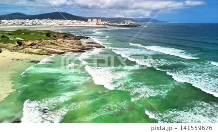 Enjoy a Beautiful and Exquisite Aerial View of a Serene Coastal Landscape with Gentle Waves Enjoy a Beautiful and Exquisite Aerial View of a Serene Coastal Landscape with Gentle Waves 141559676