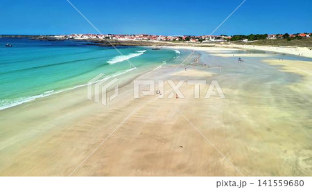 Experience the Stunning Aerial View of a Serene Beach with Beautiful, Crystal Clear Water Experience the Stunning Aerial View of a Serene Beach with Beautiful, Crystal Clear Water 141559680