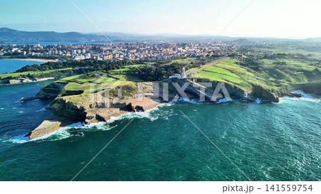 Experience breathtaking coastal views with lush greenery and vibrant blue waters of nature Experience breathtaking coastal views with lush greenery and vibrant blue waters of nature 141559754