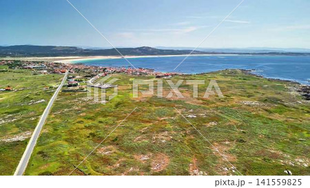 An aerial view reveals a stunning coastal landscape with beautiful beaches and rugged shores An aerial view reveals a stunning coastal landscape with beautiful beaches and rugged shores 141559825