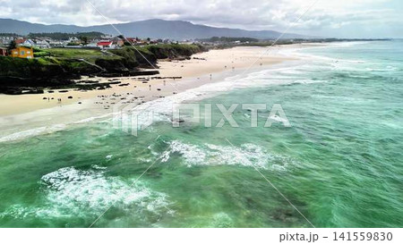 Aerial view of a scenic coastal beach with clear blue water and a stunning shoreline Aerial view of a scenic coastal beach with clear blue water and a stunning shoreline 141559830