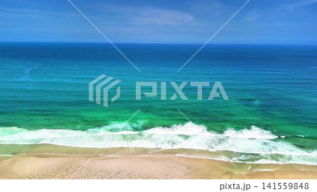 Experience the stunning tropical beach featuring extremely clear blue waters and rolling waves Experience the stunning tropical beach featuring extremely clear blue waters and rolling waves 141559848